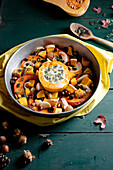 Roasted pumpkin with melted blue cheese and hazelnuts