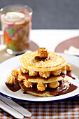 Pancake millefeuille with popcorn and melted chocolate