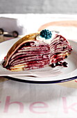 Crepes cake with blackberries