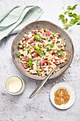 Salad with white beans, beef, feta dressing and sesame seeds