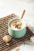 Cauliflower soup with mushrooms and parmesan cheese