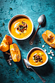 Pumpkin soup with harissa and caramelised pecan nuts
