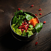 Raw vegetable salad with pomegranate seeds