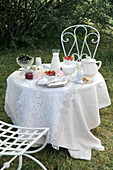 White breakfast table in the garden