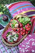 Shrimp salad with fennel and peach and a bunch of radishes for a picnic