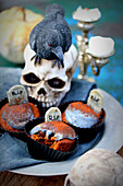 Pumpkin and orange muffins with cream cheese and lemon glaze for Halloween