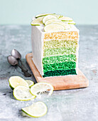 Green ombre cake with slices of lime