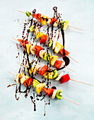 Fruit skewers with melted chocolate