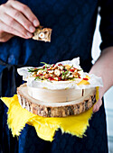 Baked camembert with hazelnuts and rosemary