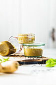 Homemade baby food with lentils and parsnips in jars