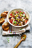 Caponata with olives and capers served with toast