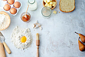 Various baking ingredients on a light background