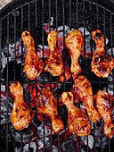 Chicken drumsticks grilling on the barbecue