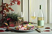 Warm haddock and potato salad and a glass of white wine
