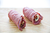 Preparing the beef roulade with Gorgonzola Saltimbocca style