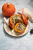 Pumpkin stuffed with chicken, mushrooms, rice and bacon