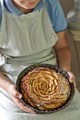 Rose cake with apples in the baking pan
