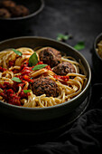 Spaghetti with vegetarian dumplings and tomato sauce