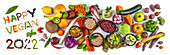 Schriftzug 'Happy vegan 2022' daneben Obst, Gemüse und Getreide