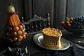 Pie, tart with candied fruits and bowl with fresh fruits