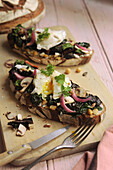 Swiss chard and a poached egg on sliced brown bread