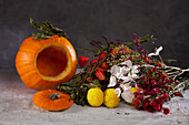 Accessories for Halloween flower arrangement: dried flowers and hollowed pumpkin