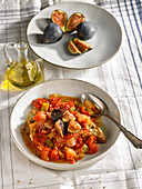 Oliagua with tomatoes, figs, peppers, olive oil, garlic and bread (Menorca, Spain)