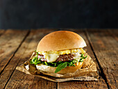 Chicken burger with brie and arugula