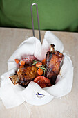 Pork ribs with vegetables in a muslin cloth