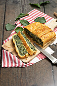 Puff pastry pie with spinach filling