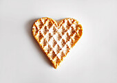 A heart-shaped wafer against a white background
