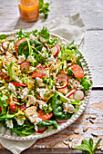 Vitamin-rich salad with grapefruit, radishes, spinach and cauliflower