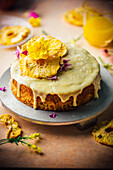 Cake with pineapple, banana and coconut and cream cheese icing