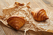 Two croissants on paper