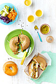 Bagels with turmeric hummus and raw vegetable salad