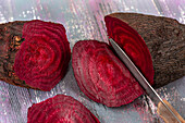 Beet cut in half and being sliced