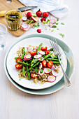 Quinoa, asparagus, radish and cherry tomato salad with pesto