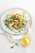 Rice salad with shrimp, radish, cucumber, and sesame