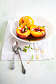 Poached peaches with verbena syrup, lemongrass, and toasted almonds