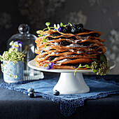 Crepe cake with barberries and blueberries