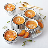 Apricot soup with thinly sliced almonds