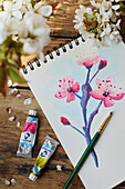 Water color of cherry blossom on an old fashioned table