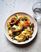 Artichoke bases with aubergines,black olives,cheese and tomatoes