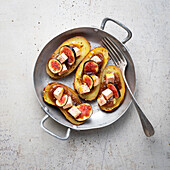 Potatoes garnished with foie gras and fig chutney