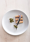 Foie gras with pork's cheeks and sardines