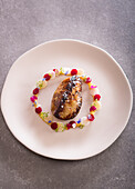 Pan-fried duck foie gras escalope with root vegetables and a wild plum coulis