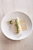 Duck foie gras poached in a yuzu marine broth,golden ball turnip and smoked eel foam