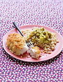 Breaded piece of cod with bulgur and leeks