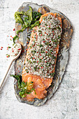 Salmon gravlax with seaweed, coarse sea salt, sea lettuce and pink berries