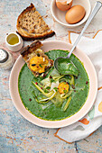 Cold spinach and leek veloute, avocado, toast with egg yolk cooked in the fridge